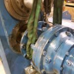 Cylindrical machine assembly supported by lifting straps