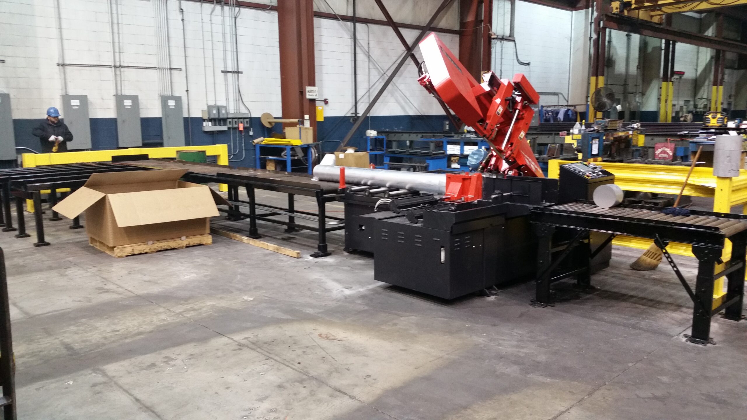Custom saw table installed with industrial cutting equipment.