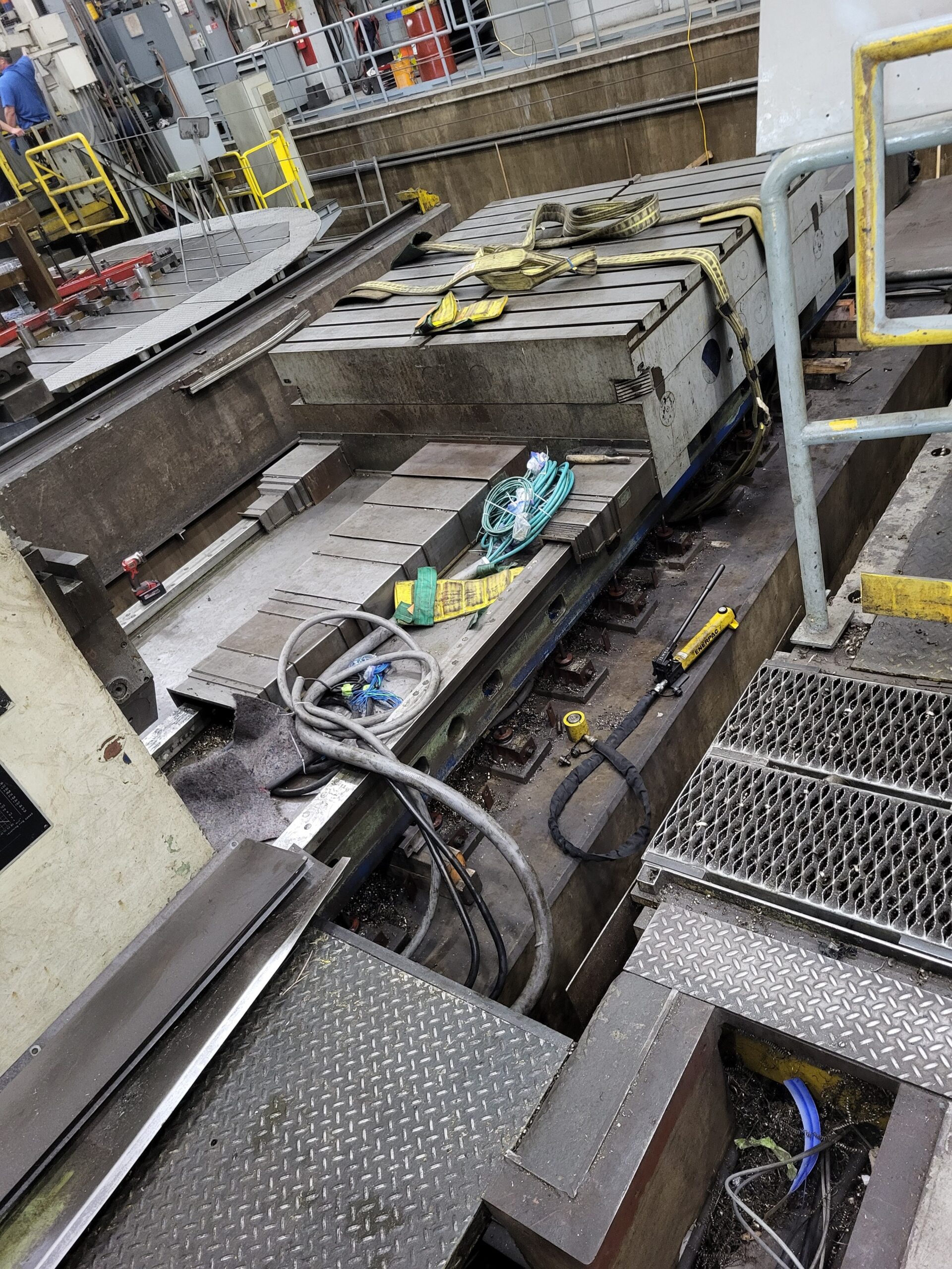 Connections and machine components exposed during relocation preparation.