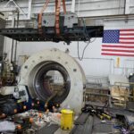 Large horizontal boring machine assembly lifted clear during removal
