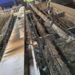 Removing heavily encrusted sections of the original slat bed