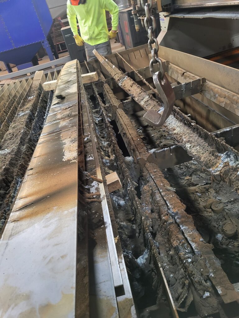 Removing heavily encrusted sections of the original slat bed