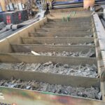 Compacted cutting debris remaining after removal of the primary slat sections