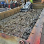 Mechanical removal of accumulated material from the table cavity