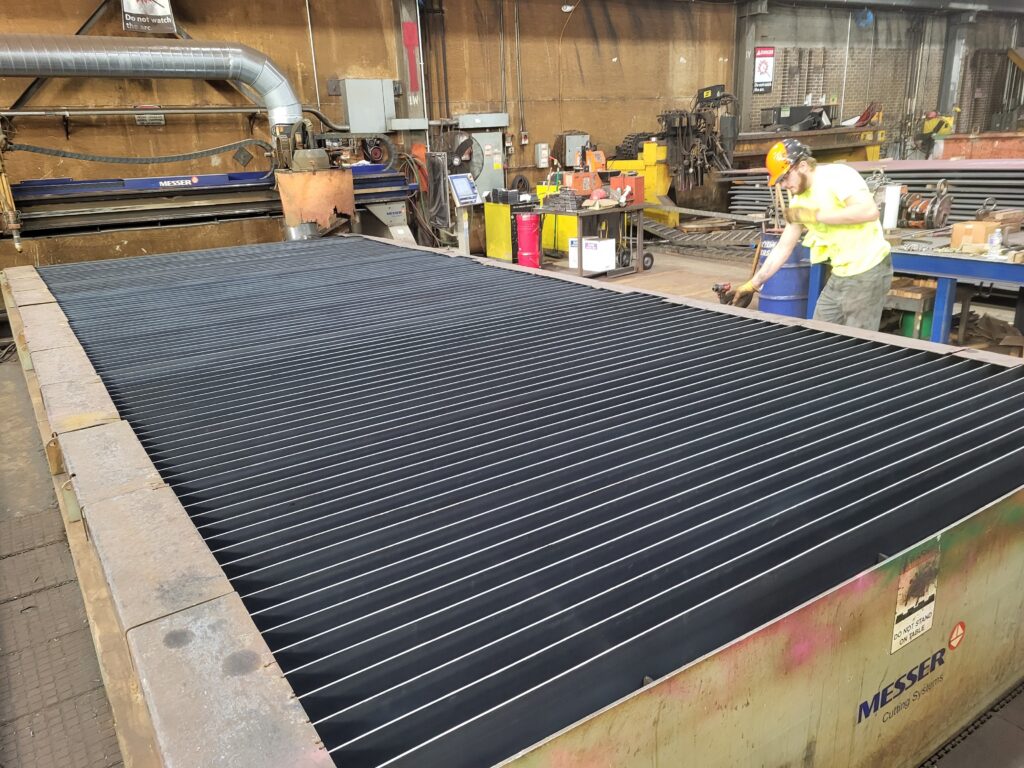 Plasma cutting table after cleanout with a complete new slat bed installed