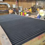 Plasma cutting table after cleanout with a complete new slat bed installed