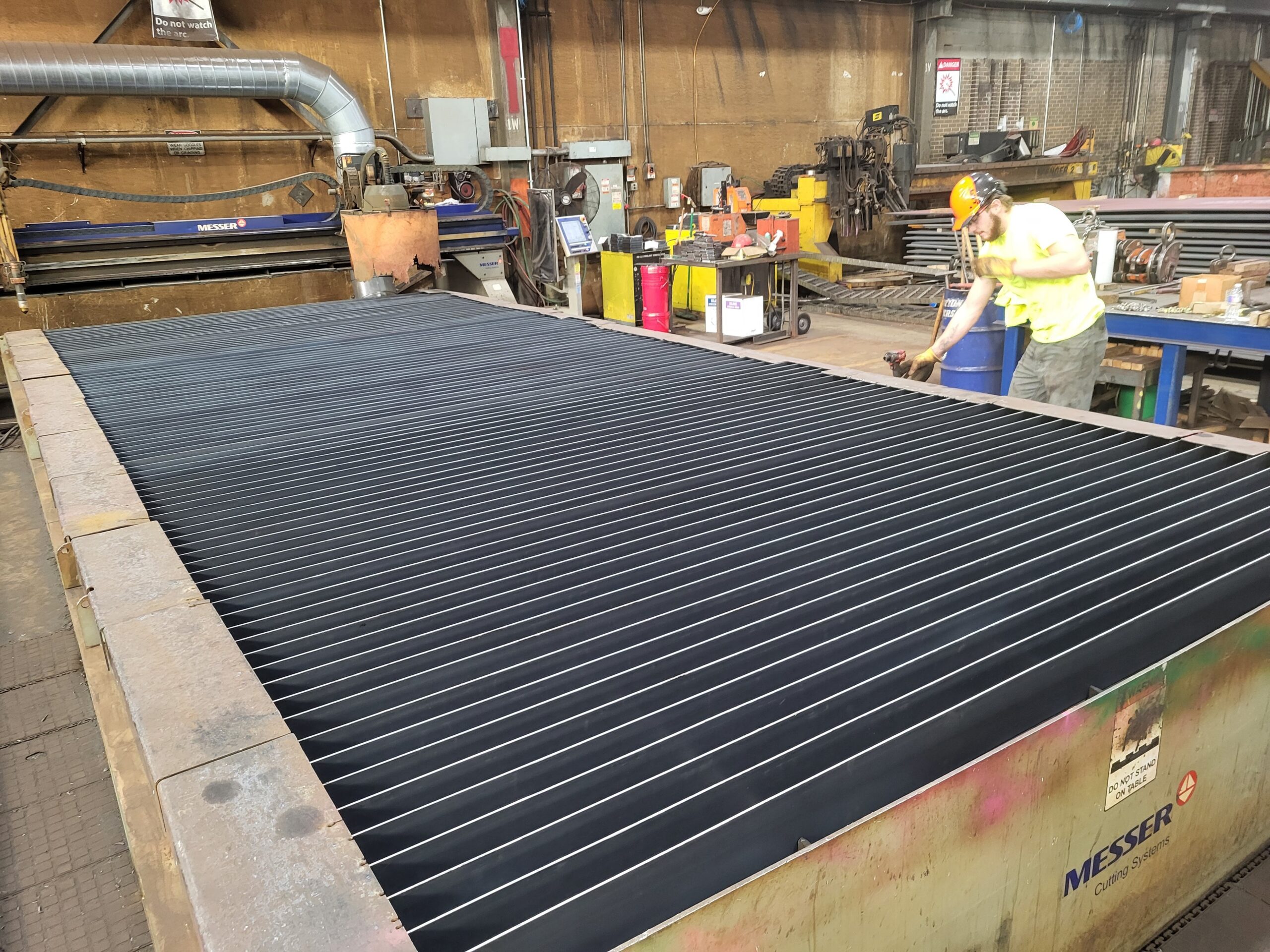 Plasma cutting table after cleanout and complete slat replacement.