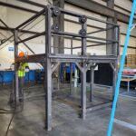 Large welded steel frame in a shop. View 2 of 2