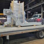 Packaged horizontal boring machine component secured on a flatbed for transport