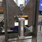 Welded workstation frame shown upright from several sides. View 1 of 3