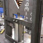 Welded workstation frame shown upright from several sides. View 2 of 3