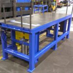 Completed-looking blue workstation in the shop
