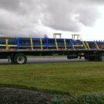 Completed industrial tables loaded on a flatbed truck