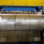 Close view of a polished cylindrical machine assembly