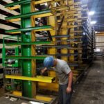 Work at the lower section of an industrial rack row