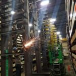 Industrial rack repair work between existing rack rows