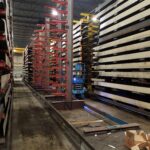 Work area beside existing industrial rack rows