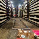 Cleared industrial rack aisle prepared for replacement components