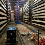 Replacement industrial rack structure positioned in an aisle