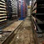 Replacement industrial rack structure between material rows