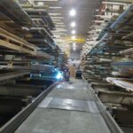 Industrial rack repair work between loaded rack rows