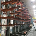 Long view of industrial rack framing and storage arms