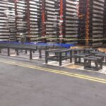 Industrial table assemblies arranged during fabrication