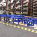 Painted industrial material staging and skid tables
