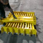 Industrial rack components being loaded on a flatbed truck