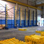Organized industrial rack components on a flatbed truck