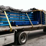 Loaded industrial rack components prepared for shipment