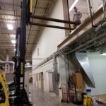 Equipment being handled at the original second-floor area during relocation