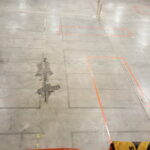 Floor markings for the new cut-and-sew line and sewing workstation layout